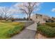 Community pool with bridge access and pool house in a serene neighborhood setting at 8510 Independence Way, Arvada, CO 80005