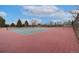 Outdoor community tennis court with well-maintained surface and net for active recreation at 8510 Independence Way, Arvada, CO 80005