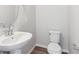 Powder room featuring a pedestal sink and modern fixtures at 453 Interlocken Blvd # 103, Broomfield, CO 80021