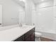 Bathroom with a vanity, a large mirror, and a shower/tub combination at 453 Interlocken Blvd # 103, Broomfield, CO 80021