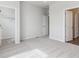 Spacious bedroom with neutral carpeting, closet, and access to private ensuite bathroom at 453 Interlocken Blvd # 103, Broomfield, CO 80021