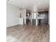 Open-concept living space with seamless flow between the living room and kitchen area at 453 Interlocken Blvd # 103, Broomfield, CO 80021