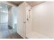 Clean bathroom with white tile shower surround at 12983 W Ida Ave # 401, Littleton, CO 80127