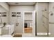 Modern bathroom with double vanity and walk-in shower at 12983 W Ida Ave # 401, Littleton, CO 80127