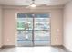 Living room with sliding glass door to balcony and mountain view at 12983 W Ida Ave # 401, Littleton, CO 80127