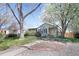 Charming single-story home with lush lawn, mature trees, and inviting curb appeal at 1842 S Fairfax St, Denver, CO 80222
