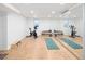 Basement gym featuring stationary bikes, free weights, yoga mats and mirrors at 1842 S Fairfax St, Denver, CO 80222