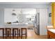 Spacious kitchen with an open layout, stainless steel appliances, granite countertops, and a breakfast bar at 1842 S Fairfax St, Denver, CO 80222