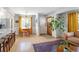 Open-concept design seamlessly connects the living area with the kitchen and dining nook at 1842 S Fairfax St, Denver, CO 80222
