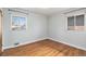 Bedroom with natural light streaming through the windows and hardwood floors at 3276 S Osceola St, Denver, CO 80236