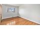 Bedroom with hardwood floors, a window, and ample space at 3276 S Osceola St, Denver, CO 80236