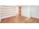 Bedroom with hardwood floors, shelving and ample storage space at 3276 S Osceola St, Denver, CO 80236