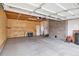 Spacious garage with concrete floors, overhead lighting, and ample storage or parking space at 3276 S Osceola St, Denver, CO 80236