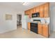 Functional kitchen with oak cabinets and essential appliances at 3276 S Osceola St, Denver, CO 80236