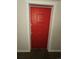 Bold red front door featuring door knocker at 1270 N Marion St # 103, Denver, CO 80218