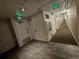 Hallway featuring exit signs, neutral paint and gray carpet at 1270 N Marion St # 103, Denver, CO 80218