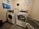Laundry room with coin operated washer and dryer at 1270 N Marion St # 103, Denver, CO 80218