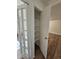 Walk-in pantry featuring open shelving, seen through glass paneled doors at 1270 N Marion St # 103, Denver, CO 80218