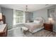 Bright bedroom with a charming chandelier and plenty of natural light at 3512 Cascina Pl # A, Highlands Ranch, CO 80126