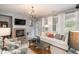 Living room with fireplace, TV and comfy seating at 3512 Cascina Pl # A, Highlands Ranch, CO 80126