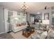 Living room features a white couch and decorative accents at 3512 Cascina Pl # A, Highlands Ranch, CO 80126