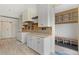 Clean and modern kitchen with white cabinets, stainless steel appliances, and a tiled backsplash at 2610 N Monroe St, Denver, CO 80205