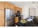 Beautiful kitchen featuring stainless appliances and wooden cabinetry at 1650 Fillmore St # 504, Denver, CO 80206