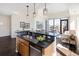 Modern kitchen featuring granite countertops, stainless steel appliances, and island with pendant lighting at 1650 Fillmore St # 504, Denver, CO 80206