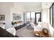 Bright living room with large windows, hardwood floors, and modern decor at 1650 Fillmore St # 504, Denver, CO 80206