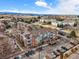 Aerial view of condo complex showcasing building and surrounding neighborhood with mountain backdrop at 2428 W 82Nd Pl # 2D, Westminster, CO 80031