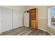 Bonus room with wood-look flooring, showing closet and storage at 2428 W 82Nd Pl # 2D, Westminster, CO 80031