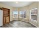 Bright bonus room with hardwood floors and lots of natural light from three windows at 2428 W 82Nd Pl # 2D, Westminster, CO 80031
