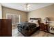 Bedroom with a large bed, side tables, and neutral walls at 2428 W 82Nd Pl # 2D, Westminster, CO 80031