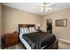 Bedroom with a large bed, side tables, ceiling fan, and closet at 2428 W 82Nd Pl # 2D, Westminster, CO 80031