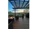 Inviting back deck with outdoor seating, a fire pit, and a view of the community at 743 Briar Haven Dr, Castle Pines, CO 80108