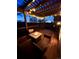 Inviting back deck with outdoor seating and a fire pit, perfect for evening relaxation at 743 Briar Haven Dr, Castle Pines, CO 80108