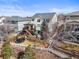 Aerial view of backyard featuring deck, patio, trampoline, and fenced-in yard at 743 Briar Haven Dr, Castle Pines, CO 80108