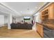 Finished basement featuring a wet bar, a large TV, a comfortable couch, and ample space for entertaining and relaxation at 743 Briar Haven Dr, Castle Pines, CO 80108