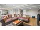 Finished basement with workout area, spacious media area, plush throw pillows and modern flooring at 743 Briar Haven Dr, Castle Pines, CO 80108
