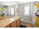 Bright bathroom featuring eye catching wallpaper, modern fixtures, and patterned shower curtain at 743 Briar Haven Dr, Castle Pines, CO 80108
