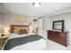 Cozy bedroom featuring carpeted floors and decoratively placed throw pillows on a queen-sized bed at 743 Briar Haven Dr, Castle Pines, CO 80108