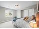 Cozy bedroom featuring a large window, closet, plush bed and neutral tones, creating a relaxing and inviting atmosphere at 743 Briar Haven Dr, Castle Pines, CO 80108