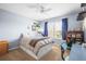 Bedroom with a ceiling fan, a bed, natural light, and a desk area at 743 Briar Haven Dr, Castle Pines, CO 80108