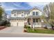 Charming two-story home featuring a covered porch, well-kept lawn, and a two car garage at 743 Briar Haven Dr, Castle Pines, CO 80108