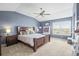 Serene main bedroom with vaulted ceilings, a ceiling fan, and ample natural light at 743 Briar Haven Dr, Castle Pines, CO 80108