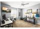 Well-lit office with dual desks, a mounted TV, and stylish decor, creating an inspiring and productive workspace at 743 Briar Haven Dr, Castle Pines, CO 80108
