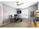 Modern office space with dual monitors, a comfortable chair, a window for natural light, and stylish decorations at 743 Briar Haven Dr, Castle Pines, CO 80108
