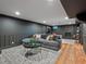 Finished basement featuring a stone fireplace, hardwood floors, and a comfortable seating area at 3030 Alkire St, Golden, CO 80401