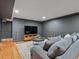 Finished basement with hardwood floors, television, and seating area at 3030 Alkire St, Golden, CO 80401