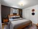Bedroom includes large windows, warm colors and hardwood floors at 3030 Alkire St, Golden, CO 80401